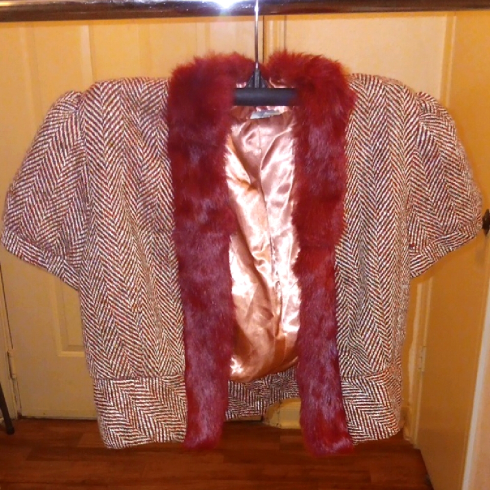Elegant Women's Herringbone Jacket with Faux Fur Trim. The color is Burgandy